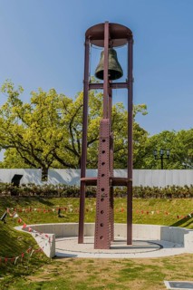 Metal bell tower in urban park in Hiroshima, Japan, Asia