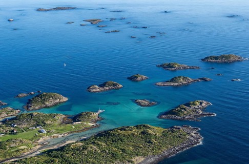 Coast and rocky islands in the blue sea, sea with archipelago islands, Ulvagsundet, Vesteralen,