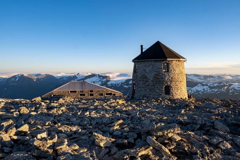 DNT's old and new mountain huts Skalatarnet at sunset, mountains with Jostedalsbreen glacier in the