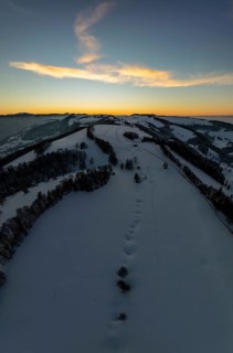 Sunset over the second Jura chain in winter, foreground contours of sinkholes, view towards the