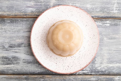 Buckwheat milk jelly on gray wooden background. top view, flat lay