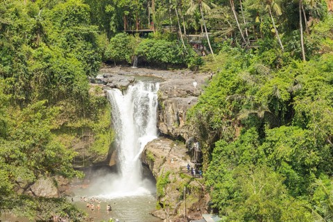 Tegenungan waterfall, Bali island, Ubud, Indonesia. Jungle, tropical forest, daytime with cloudy