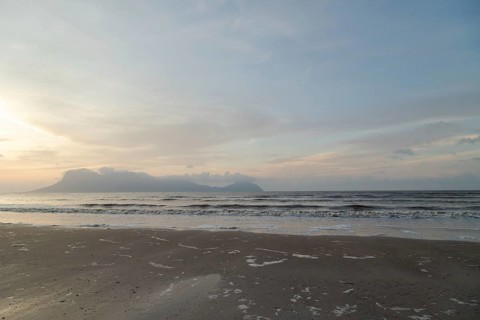 Bako national park, sea sandy beach, overcast, cloudy sunset, sky and sea, low tide. Vacation,
