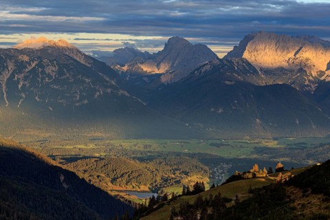 Distant view of steep mountains in the evening light, clouds, autumn, view from Wank to Karwendel