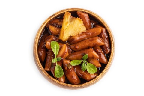 Tteokbokki or Topokki, fried rice cake stick, popular Korean street food with spicy jjajang sauce