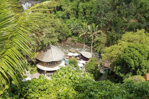 Tegenungan waterfall, Bali island, Ubud, Indonesia. Jungle, tropical forest, daytime with cloudy