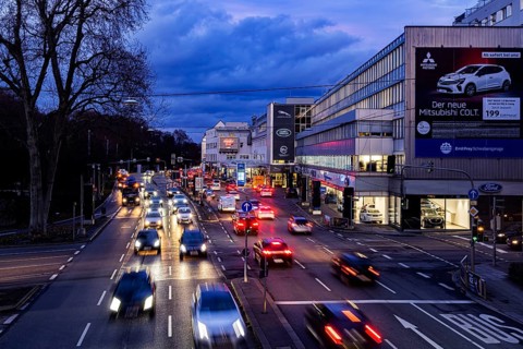Cars with light trails in the evening, city centre traffic on busy B14 federal road at Neckartor,