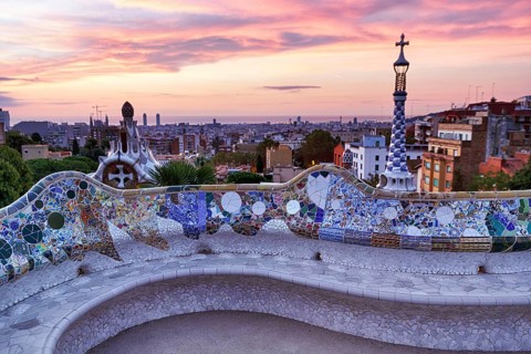 Curved bench, ceramic mosaic, Trencadis, viewing platform at sunrise, Park Güell, Barcelona, Spain,