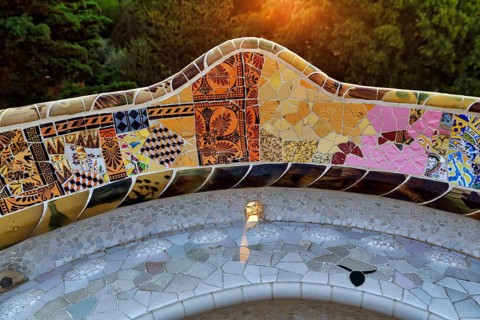 Curved bench, ceramic mosaic, Trencadis, sunrise, Park Güell, Barcelona, SpainTrencadis