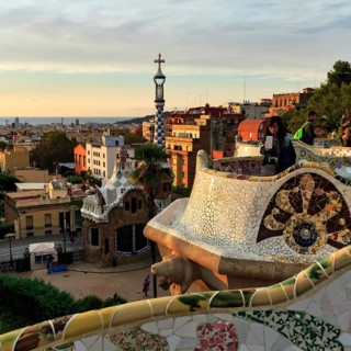 Curved bench, ceramic mosaic, Trencadis, viewing platform at sunrise, Park Güell, Barcelona, Spain,