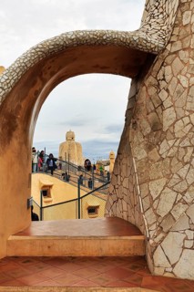 Tourists between artistically designed fireplaces on the roof terrace in the museum, Garden of the