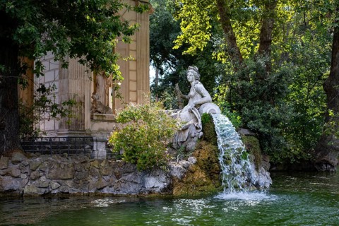 Temple of Aesculapius, Villa Borghese Lake. Water fountain statue detail. Rome, Italy, Europe