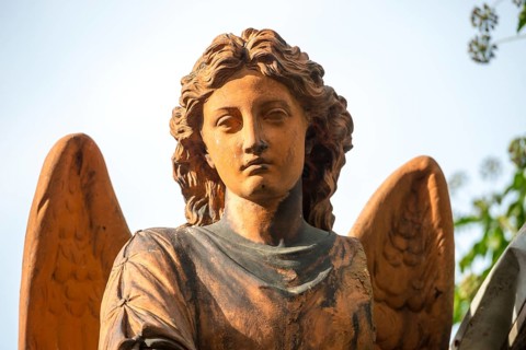 Terracotta-coloured angel statue, female angel figure, angel statue with curls and finely crafted