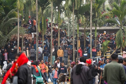 Large group of people looking traditional Moh-Juj (Buffalo fight) competition as a part of Magh