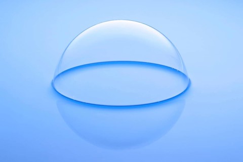 A large soap bubble on light blue water