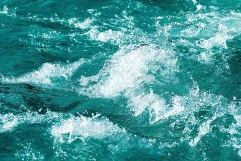 Turquoise-coloured foaming clear water of a mountain stream near Hinterriss, Bavaria, Germany,
