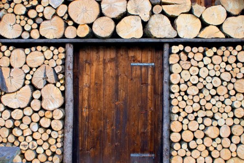 Picturesque woodpile, more for decoration, sawn logs, at a wooden hut near Garmisch-Partenkirchen,