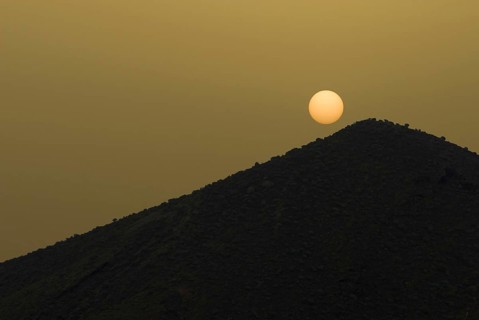 The sun on Tenerife on a volcanic hill, obscured by sahara dust, calima, Canary Islands, Spain,