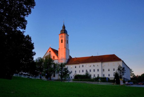 Monastery church Mariae Himmelfahrt in the evening sun, sunset, Dietramszell, Bavaria, Germany,