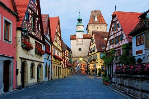 Town view with old half-timbered houses and old town gate in Rothenburg ob der Tauber, blue hour,