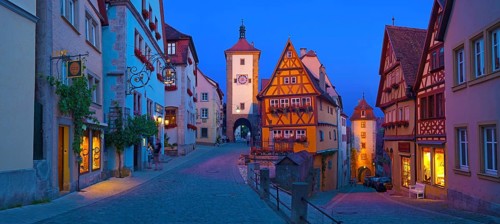 Town view of Rothenburg ob der Tauber in the evening at blue hour, in the foreground the Plönlein
