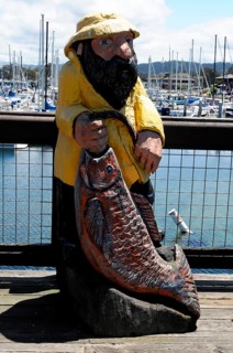 Fisherman, sculpture, wooden figure in the harbour, Monterey, California, USA, North America