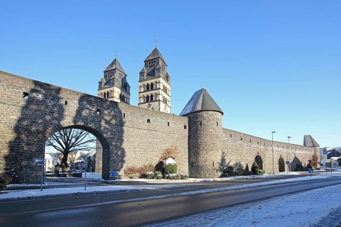 Historic town wall built in the 14th century and neo-Romanesque Herz-Jesu-Kirche with twin towers