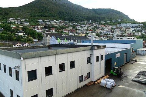 Port buildings and traditional houses in coastal town of Kristiansund, Romsdal county, Norway,