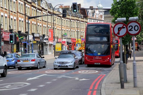Red double-decker Stagecoach 136 bus in New Cross Road, Deptford, south London, England, UK