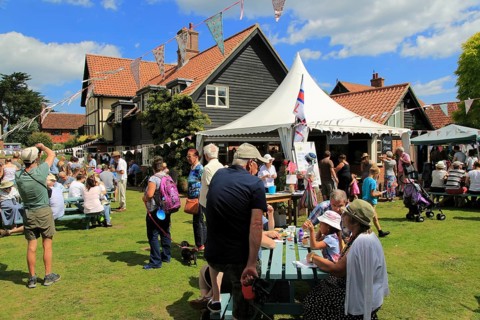 People at summer village fete, Thorpeness, Suffolk, England, UK
