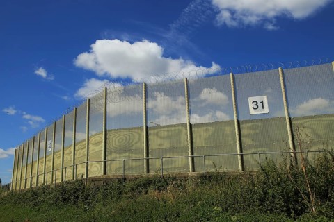 Perimeter fence at Warren Hill prison, Hollesley, Suffolk, England, UK