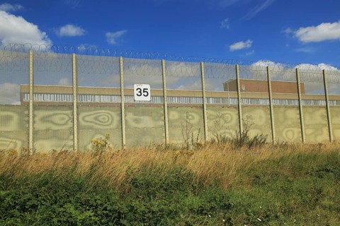 Perimeter fence at Warren Hill prison, Hollesley, Suffolk, England, UK