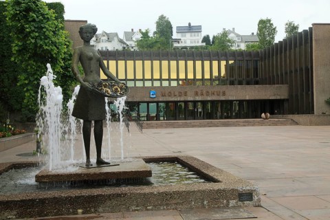 Town hall 'Radhus' building in town centre of Molde, Romsdal county, Norway with water fountain