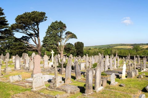 Gravestones in churchyard parish church at St Keverne, Lizard Peninsula, Cornwall, England, UK