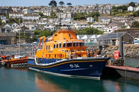 RNLI lifeboat in the harbour of fishing port of Newlyn, Cornwall, England, UK