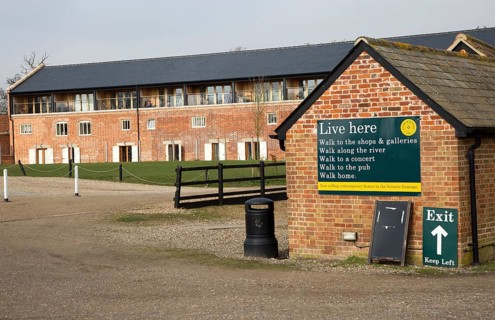 Former industrial buildings converted into housing for sale, Snape Maltings, Suffolk, England, UK