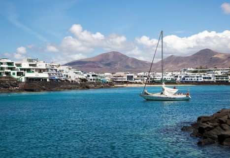 Yacht arriving in harbour at Playa Blanca, Lanzarote, Canary Islands, Spain, Europe