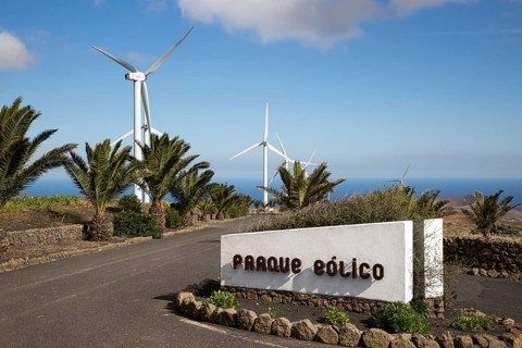 Turbines and sign at Parque Eolico de Lanzarote wind farm, Lanzarote, Canary Islands, Spain, Europe