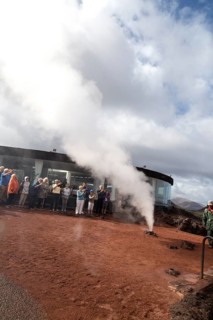 Tourists watch steam rise from geyser spout, Parque Nacional de Timanfaya, national park,