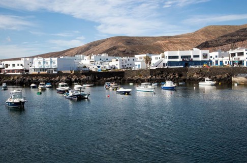 Harbour and white houses in the fishing village of Orzola, Lanzarote, Canary Islands, Spain, Europe