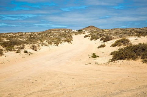 Inland sand dune landscape with unsealed sandy dirt roads La Isla Graciosa, Lanzarote, Canary