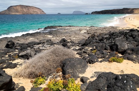 Montana Clara island nature reserve and sandy beach Playa de las Conchas, Graciosa island,