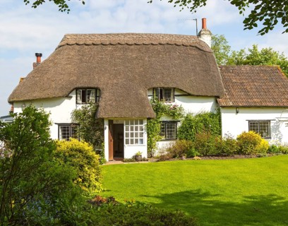 Pretty historic thatched cottage and garden, Cherhill, Wiltshire, England, UK