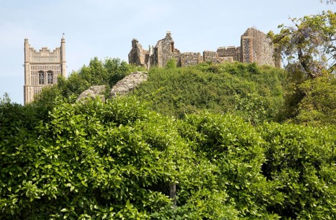 Norman motte and bailey castle with Victorian building ruin Eye, Suffolk, England, UK