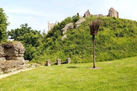 Norman motte and bailey castle with Victorian building ruin Eye, Suffolk, England, UK