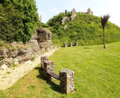 Norman motte and bailey castle with Victorian building ruin Eye, Suffolk, England, UK