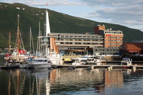 Modern architecture of Scandic Hotel and boats in harbour, city centre of Tromso, Norway, Europe