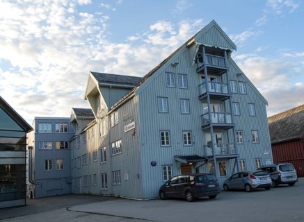 Waterside old warehouse wooden buildings harbour area, Tromso, Norway, Europe