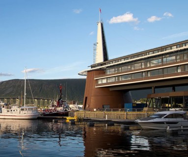 Modern architecture of Scandic Hotel and boats in harbour, city centre of Tromso, Norway, Europe