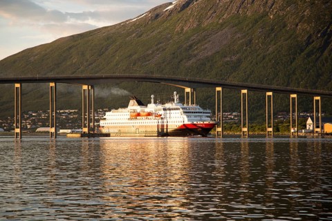 Hurtigruten ferry ship Nordlys approaching Tromso passing under cantilever bridge, Norway, Europe